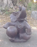 Sitting elephant with a ball